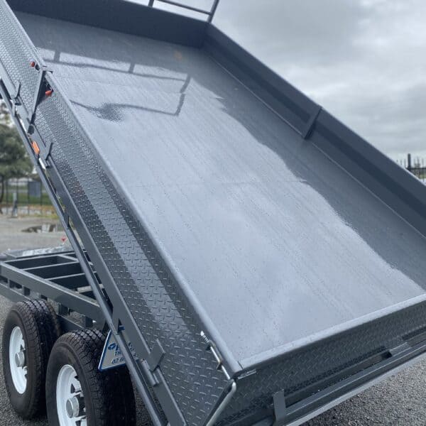 Grey tipping trailer close-up view