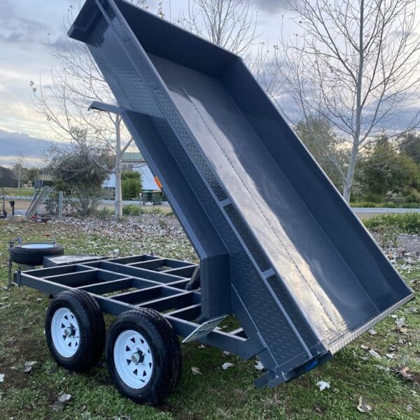 Tandem axle tipping trailer in yard